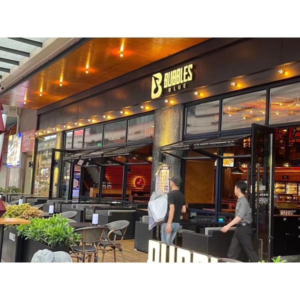 Slim-Profile Frameless Folding Window Illusion Creating Near-Invisible Transitions Between Interior and Deck Areas