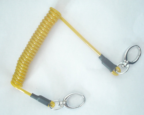 Buy Flexible transparent yellow expanding spring coil tool lanyard with 2pcs oval metal hooks at wholesale prices