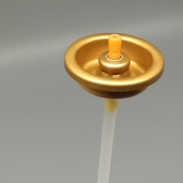 Air freshener spray valve close-up view showing nozzle details