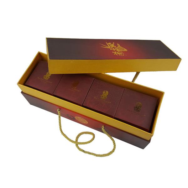 Buy Gold CMYK Full Colors Rigid Cardboard Material Lid Box Bottom Packing Box with Thick PP Handle Rope at wholesale prices