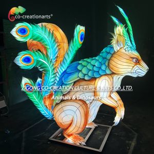 Giant Illuminated Squirrel Sculpture Lantern With Dazzling Peacock Feather Tail