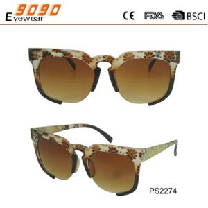 Sunglasses in fashionable design with brown color, made of plastic ,suitable for