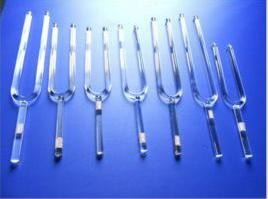Quartz crystal tuning fork with notes