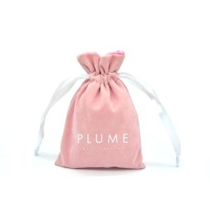 Soft Pink velvet drawstring bag with satin lining and customized white logo for
