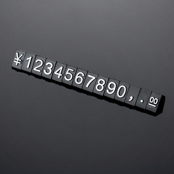 140 pcs The 5*3mm price cubes are made from black glossy plastic and have embossed white lettering