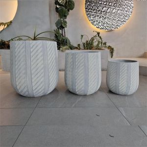 China Waterproof and Fireproof Fiber Clay Flower Planters with Modern Hand Carving Design on sale