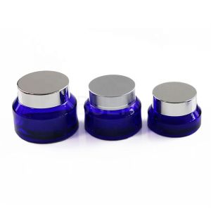 China Empty Inclined Shoulder Glass Cosmetic Jars With Sliver Screw Cap on sale