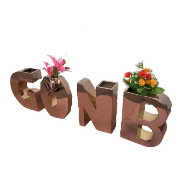 Silver flower pots on the balkon letters metal planters