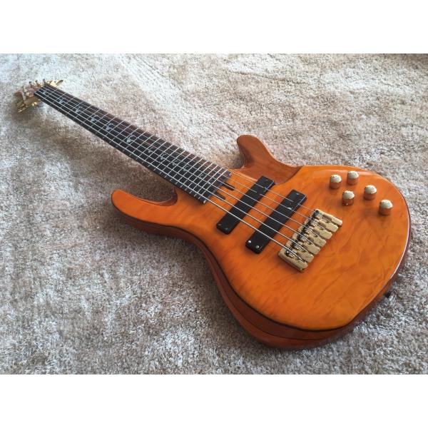Buy 6 string bass guitar JP2 yellow quilted maple body back and front Active pickups Golden bridges and tuner Alder with ebo at wholesale prices