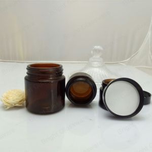 Face cream amber glass jar with black plastic cap