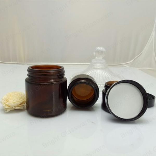 Face cream amber glass jar with black plastic cap