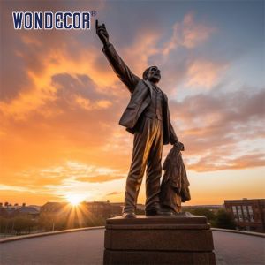 Bronze sculptures of figures in large outdoor square parks