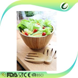 wooden bamboo salad bowls with serving hands and serving bowls