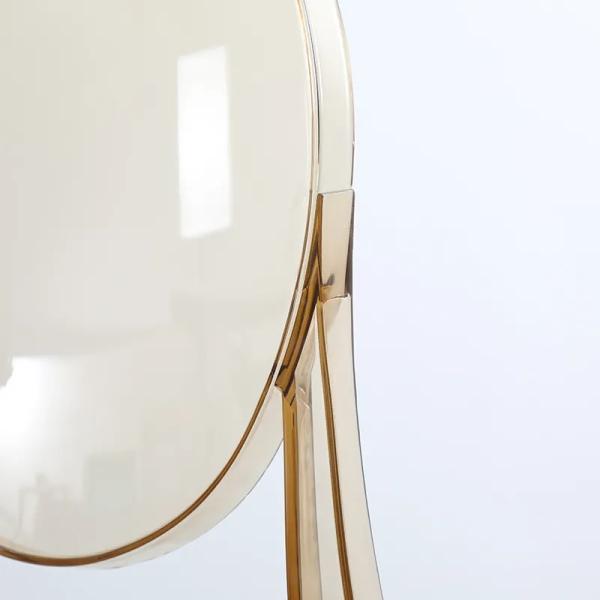 Clear plastic chairs stacked for storage