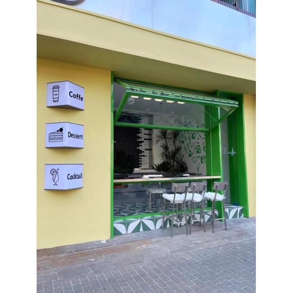 Dusk Wine Country Folding Window Framing Sunset Over Grapevines from Living Room Seating Areas