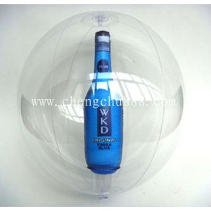 Inflatable beach ball with bottle inside