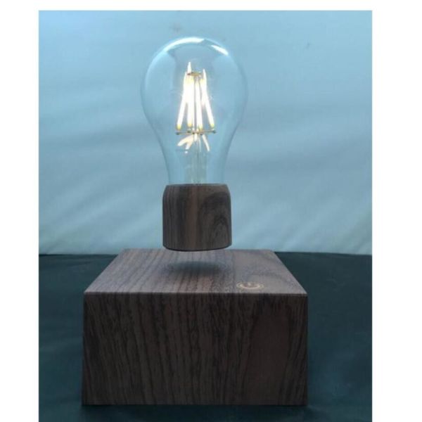 Buy wooden base wireless recharging magnetic floating levitation lamp light bulb at wholesale prices