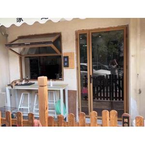 Interior Courtyard Folding Window Connection Enabling Climate-Controlled Access