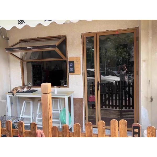 Interior Courtyard Folding Window Connection Enabling Climate-Controlled Access to Enclosed Garden Spaces