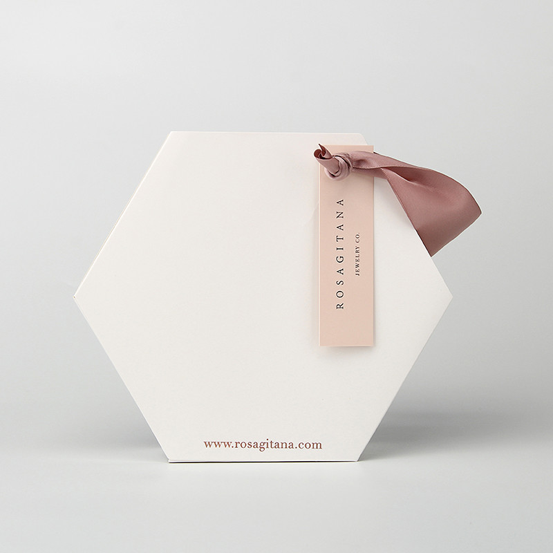 China Special Design Hexagon Jewelry Paper Bag Custom Paper Shopping Bags With Ribbon on sale