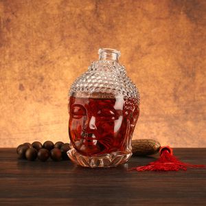 Aluminum Plastic PP Collar 750ml Clear Glass Spirits Bottle in Unique Buddha