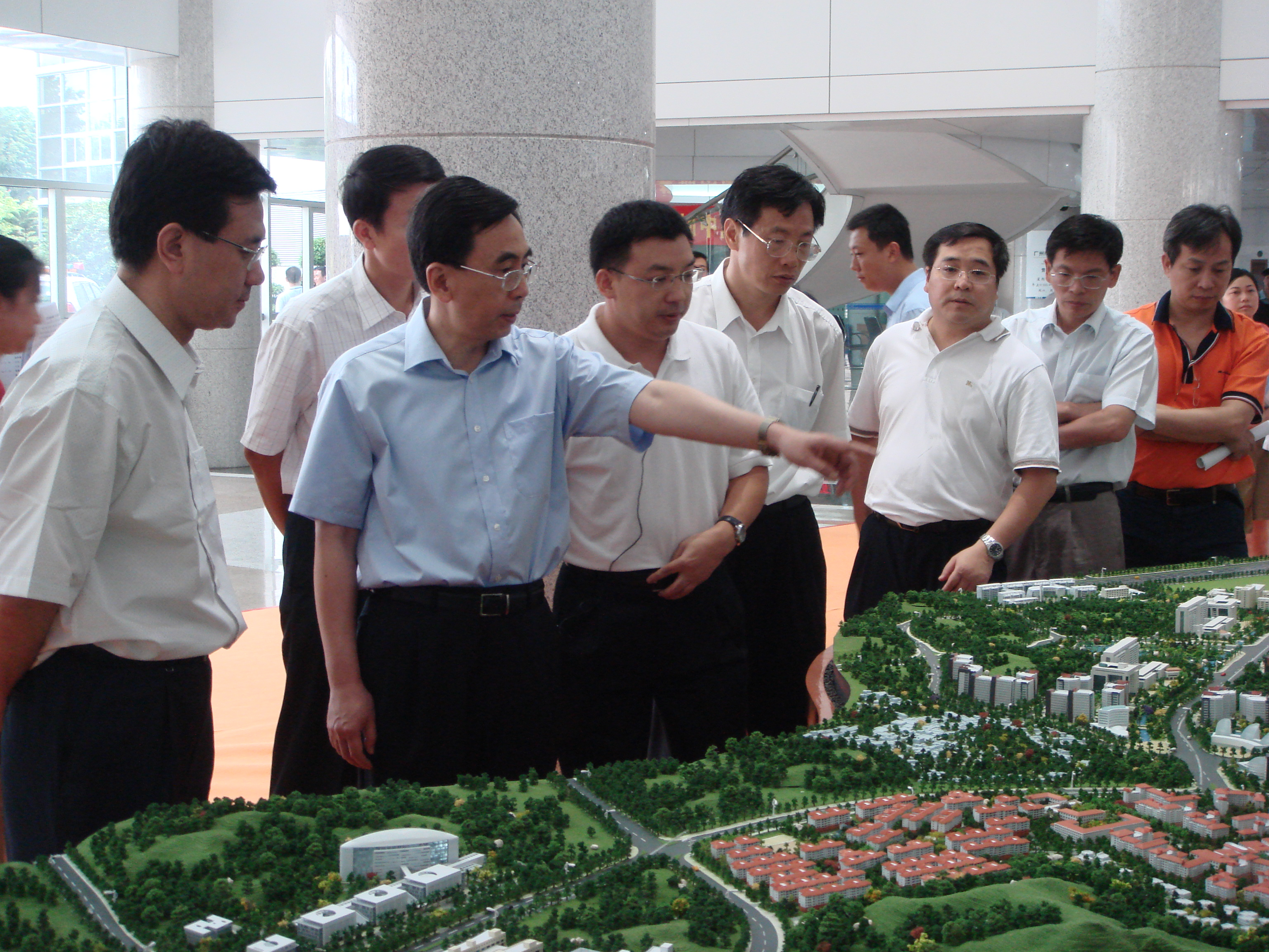 Architectural Model of Futuristic Glass Skyscraper with Illuminated Facade and