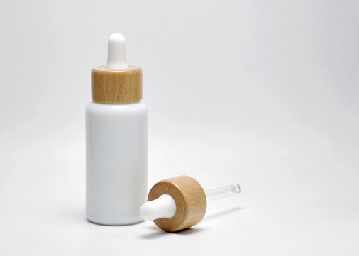 Buy Jade Porcelain White 40ml Boston Round Opal Glass Bottle With Wooden Dropper Cap For Face Oil, Facial Serum, Beauty Oil at wholesale prices
