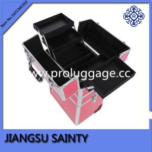 Beautiful pink crocodile beauty cases on wheels