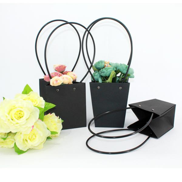 Buy Waterproof Flower Packaging Carry Kraft Paper Bag With Plastic Handle at wholesale prices
