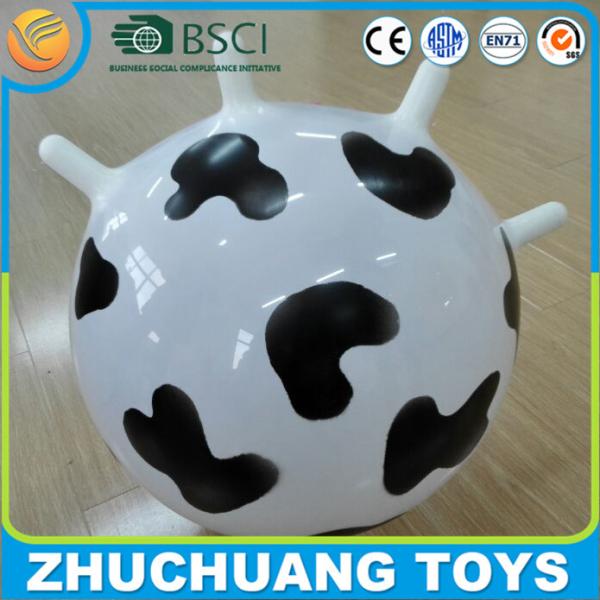 Buy milk cow pattern gymnic hopper balls with handles at wholesale prices