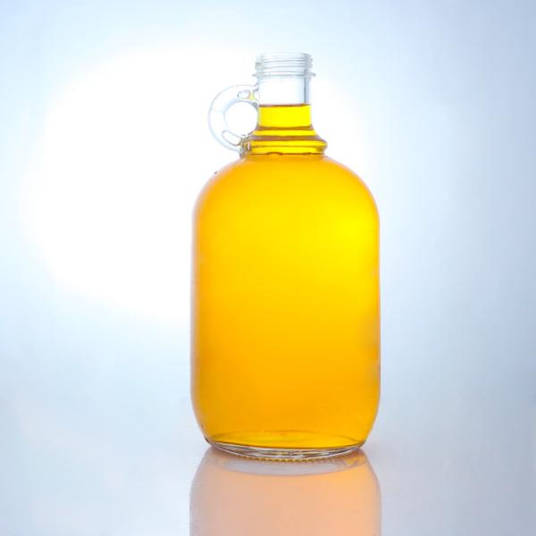 Buy Customized Logo Round Shape Liquor Glass Bottle with Handle and Screw Cap at wholesale prices