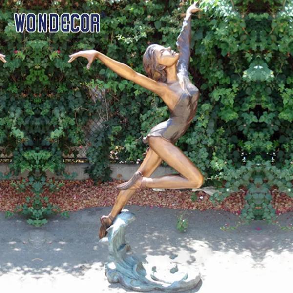 Outdoor garden decoration, a bronze statue of a beautiful woman dancing at the size of a real person