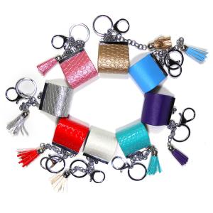China Sliver Plating Smooth Surface Coin Bag Keychain With Red Tassel on sale