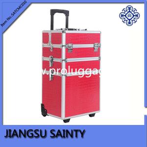 Beautiful pink crocodile beauty cases on wheels