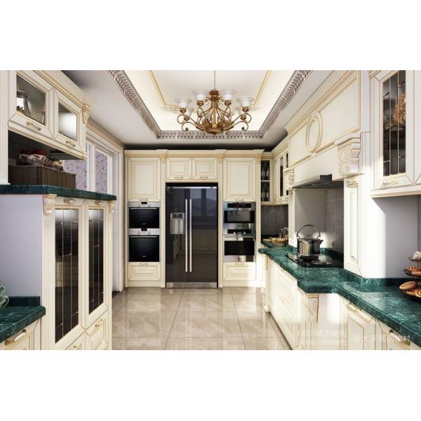 Opulent and Refined Custom Stainless Steel Kitchen Cabinetry with Deep Green Marble Countertop and Soft-Close Doors