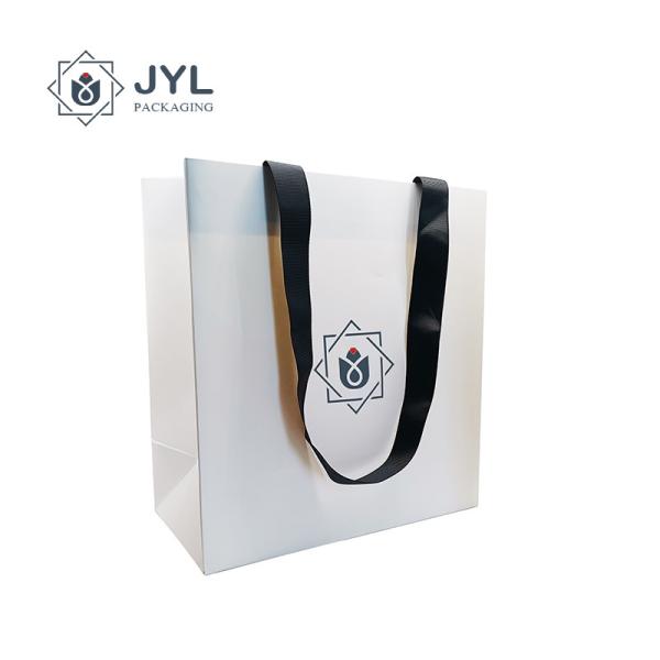 Buy RoHs Embossing Recycled Paper Gift Bags With Handles Antibacterial Rectangle at wholesale prices