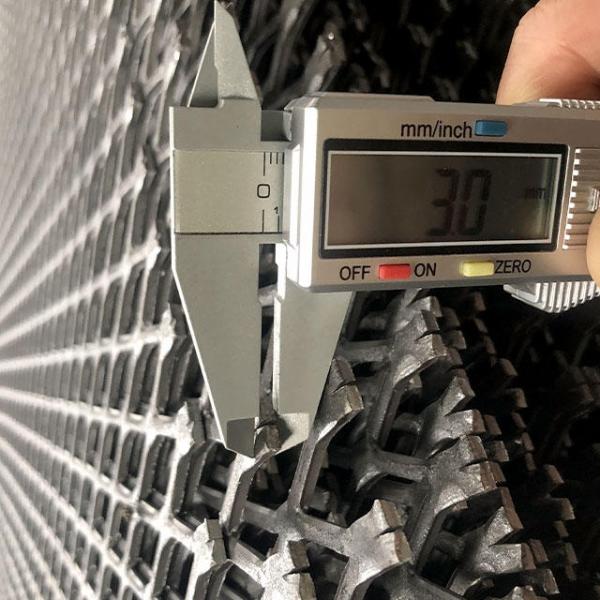 A caliper is used to test the thickness of the expanded metal mesh