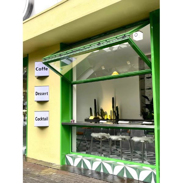 Dusk Wine Country Folding Window Framing Sunset Over Grapevines from Living Room Seating Areas