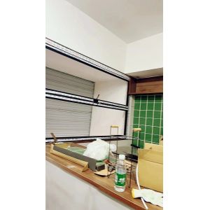 Grape Arbor Folding Window Connection Allowing Harvest Access from Kitchen