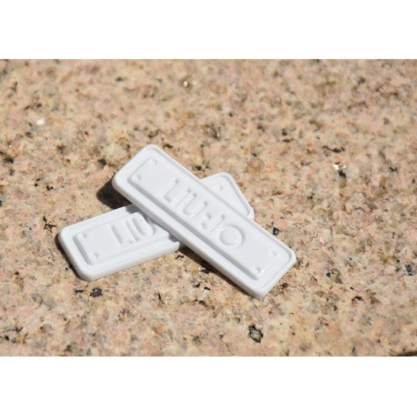 Degradable 2mm garment TPU Clothing Labels With Mould Embossed Logo