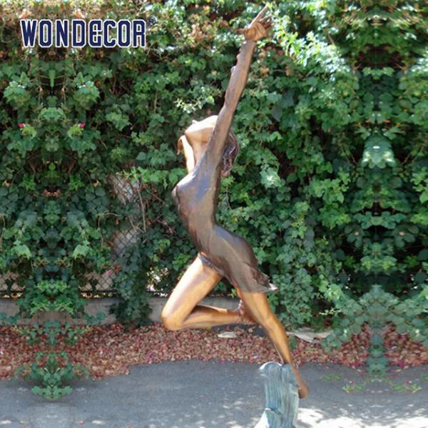 Outdoor garden decoration, a bronze statue of a beautiful woman dancing at the size of a real person