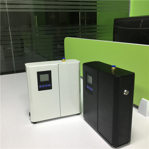 White metal wall mountable Hvac Scent Delivery System with lock and refilled oil bottle