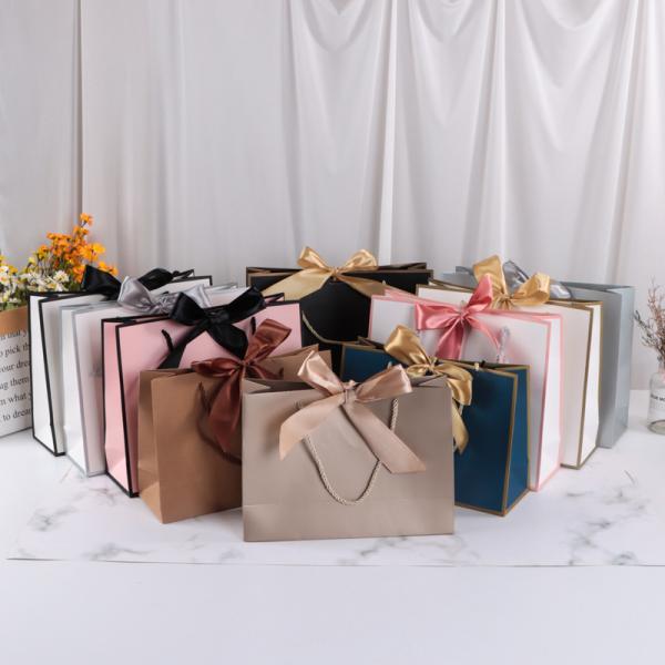 Buy Bowknot Paper Shopping Bag For Cosmetics Multi-Color Gift Bag Packaging Clothing Shopping Bag With Logo Printing at wholesale prices