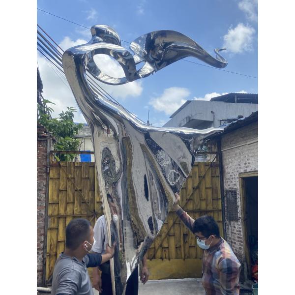 Outdoor garden courtyard decorated with stainless steel abstract sculpture