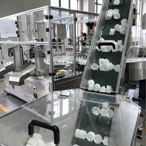 Automated assembly machine for laundry lids, PLC control, display operation,