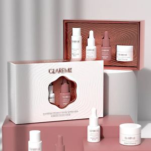 China Luxury Serum Gift Box Set Premium Cosmetic Packaging With Laser Cut Design Elegant Hollow Pattern Gold Foil Stamping on sale