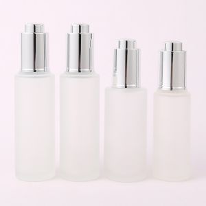 China 30ml Custom Clear frosted glass bottle With Pressure Dropper Cosmetic Skincare on sale