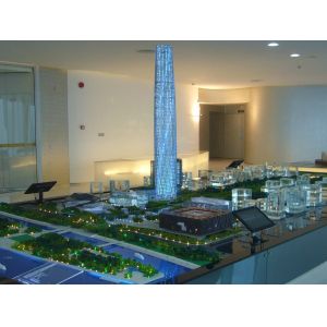 Architectural Model of Futuristic Glass Skyscraper with Illuminated Facade and