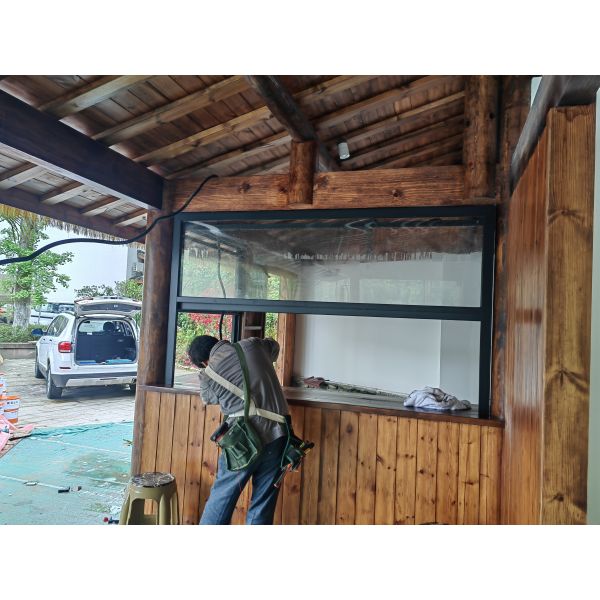 Cooking Station Folding Window Allowing Pass-Through Service to Outdoor Dining Areas During Entertaining