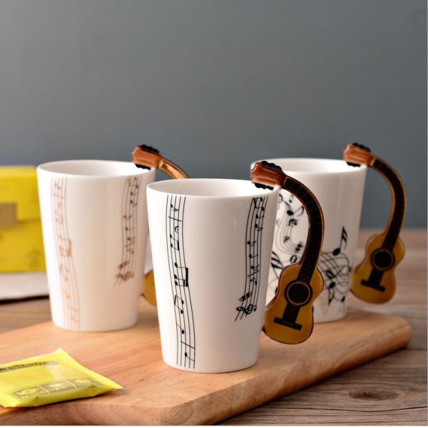Creative two tone color glazed ceramic V Shaped Mug with musical instrument handle